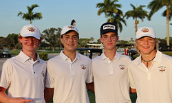 four male junior golfers posing for a photo